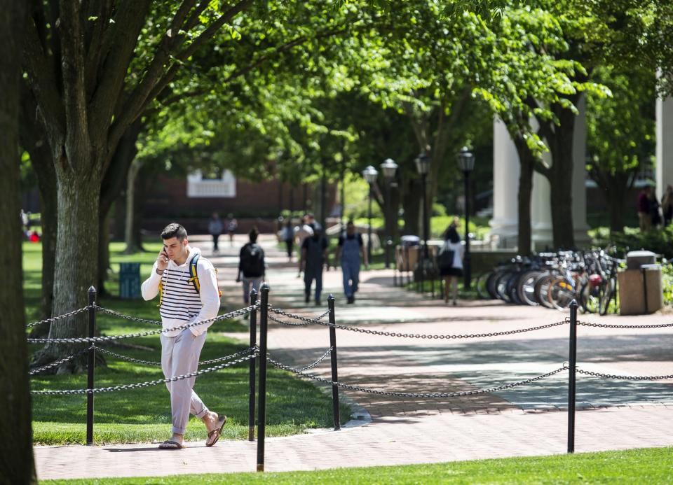 Students walk through the University of Delaware's campus in Newark in 2017. Applications to UD are at an all time high this here.