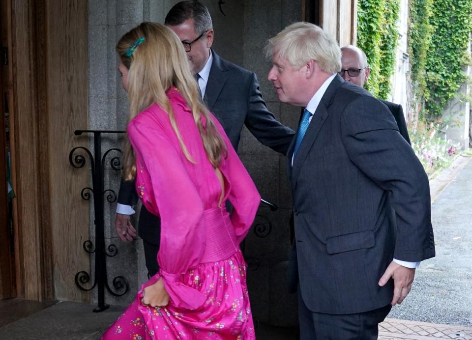 Boris Johnson and his wife Carrie Johnson are greeted at Balmoral (Andrew Milligan/PA) (PA Wire)