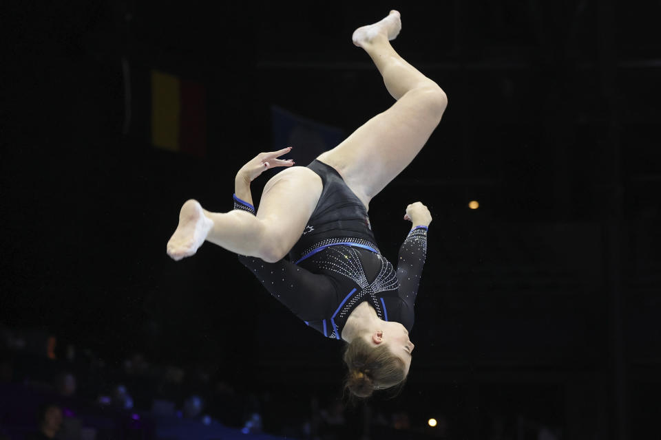 France's Morgane Osyssek-Reimer competes on the beam during the women's team final at the Artistic Gymnastics World Championships in Antwerp, Belgium, Wednesday, Oct. 4, 2023. (AP Photo/Geert vanden Wijngaert)