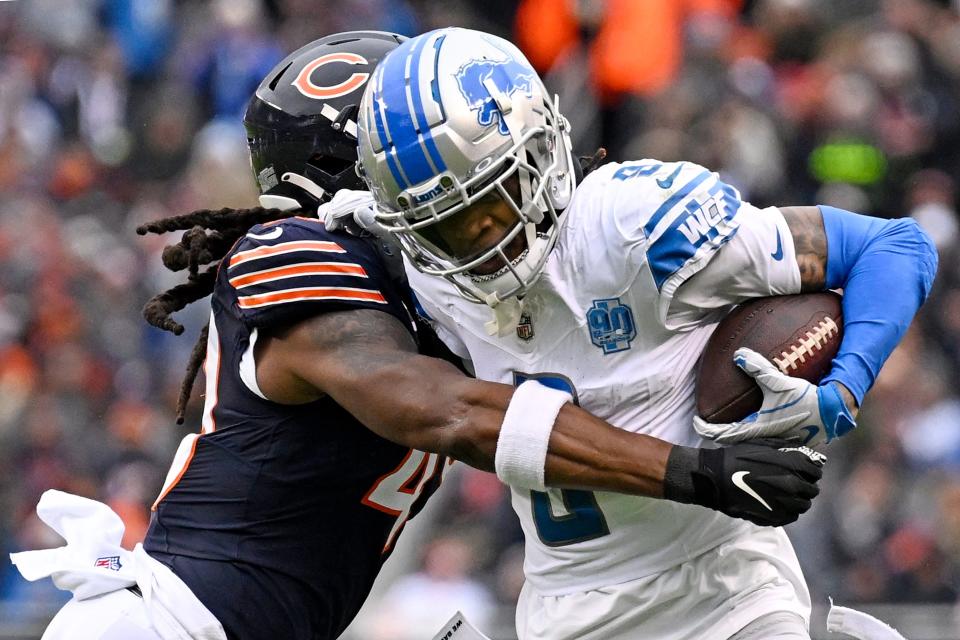 Lions wide receiver Jameson Williams is tackled by Bears linebacker Micah Baskerville during the second quarter on Sunday, Dec. 10, 2023, in Chicago.
