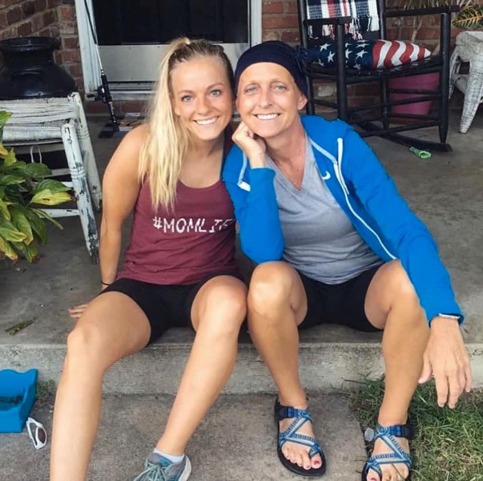 Mackenzie McKee and Angie Douthit pose on steps