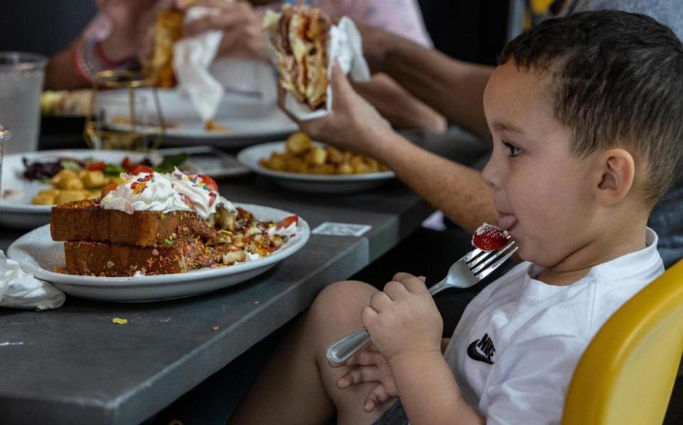 Coral Gables, FL- March 31 2023 - Three-year-old Amir Vargas digs into his Fruity Pebble French Toast at the Bistro Café in Coral Gables, 4155 Laguna Street. Jose A. Iglesias/jiglesias@elnuevoherald.com