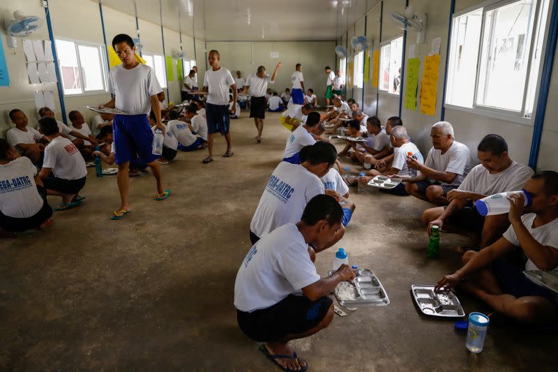 Drug rehab patients eat lunch at the Mega Drug Abuse Treatment and Rehabilitation Center, in Nueva Ecija province, north of Manila