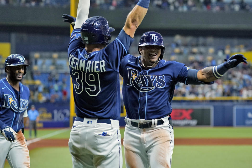 Tampa Bay Rays' Wander Franco celebrates his three-run home run off Boston Red Sox starting pitcher Eduardo Rodriguez with Kevin Kiermaier (39) during the fifth inning of a baseball game Tuesday, June 22, 2021, in St. Petersburg, Fla. (AP Photo/Chris O'Meara)