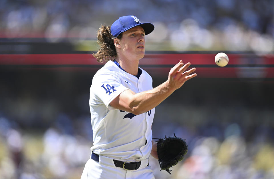 LOS ANGELES, CALIFORNIA - AUGUST 11: Tyler Glasnow #31 of the Los Angeles Dodgers tosses the ball to first base while playing the Pittsburgh Pirates at Dodger Stadium on August 11, 2024 in Los Angeles, California. (Photo by John McCoy/Getty Images)