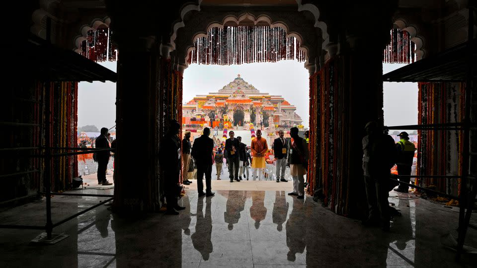 People arrive ahead of the inauguration of the temple of the Hindu god Ram in Ayodhya, northern Uttar Pradesh state, India, on January 22, 2024. - Rajesh Kumar Singh/AP
