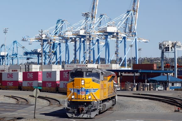 Union Pacific car pulling containers at an intermodal station.