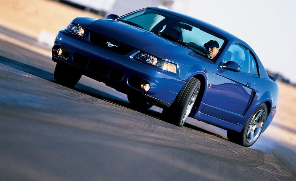 <p>The revised-and final-<a rel="nofollow noopener" href="https://www.caranddriver.com/reviews/2003-ford-svt-mustang-cobra-road-test-review" target="_blank" data-ylk="slk:SVT Mustang Cobra;elm:context_link;itc:0;sec:content-canvas" class="link ">SVT Mustang Cobra</a> from the seminal pony car's fourth generation packed a supercharged 4.6-liter V-8 good for 390 horsepower and 390 lb-ft of torque. Backed by a six-speed manual, the engine helped make the Cobra an altogether better machine than previous versions, and let it reach 60 mph in 4.5 seconds while covering the quarter-mile in 12.9 at 111 mph. The V-8's blower also let out an incessant whine that we said made the engine sound like a "floor polisher."<br></p>