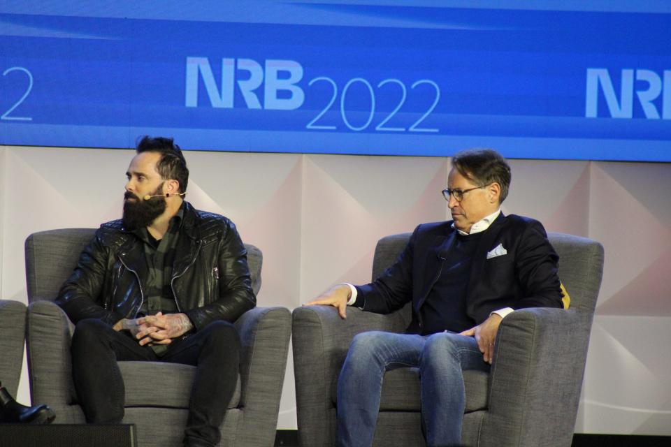 John Cooper, a Christian rock musician for the band Skillet, and Eric Metaxas at a panel during the National Religious Broadcasters annual conference on Thursday, March 10, 2022 at Nashville's Gaylord Opryland Resort & Convention Center.