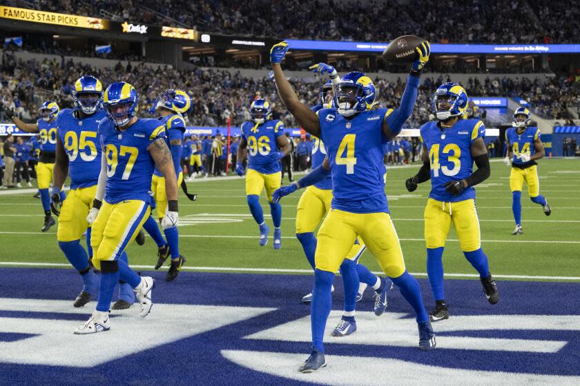Los Angeles Rams safety Jordan Fuller (4) celebrates his interception during an NFL football game against the New Orleans Saints, Thursday, Dec. 21, 2023, in Inglewood, Calif. (AP Photo/Kyusung Gong)