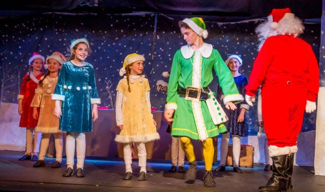 The 2017 Knoxville Children’s Theatre production of “Elf: The Musical Jr.” featured Eva Rogers, in red, and Evie Braude, in blue, as elves. Rogers is stage manager for the current production, and her younger sister Amy will play an elf. Braude, now a Webb High School senior, is the director. Nov. 2017