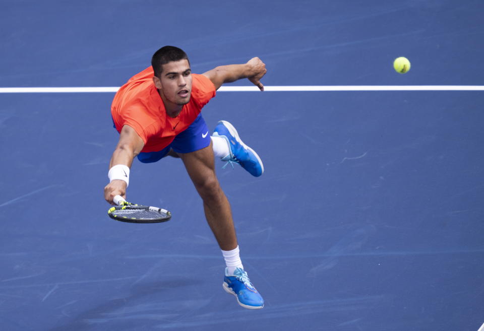 FILE - Carlos Alcaraz, of Spain, returns to Tommy Paul of the United States during second round of play at the National Bank Open tennis tournament Wednesday, Aug. 10, 2022 in Montreal. Alcaraz will compete in the U.S. Open tennis tournament that begins Monday. (Paul Chiasson/The Canadian Press via AP, File)