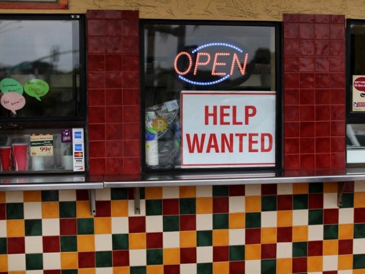 A help wanted sign is posted at a taco stand in Solana Beach, California, U.S., July 17, 2017.   REUTERS/Mike Blake 