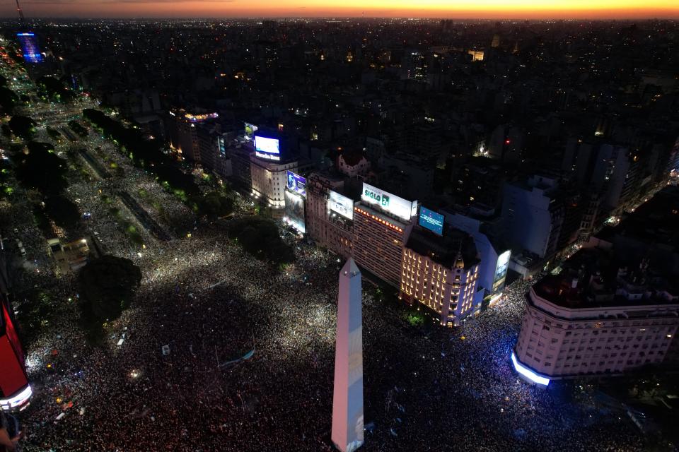 In this aerial view fans of Argentina celebrate winning the Qatar 2022 World Cup against France at the Obelisk in Buenos Aires, on December 18, 2022. (Photo by Emiliano LASALVIA / AFP) (Photo by EMILIANO LASALVIA/AFP via Getty Images)