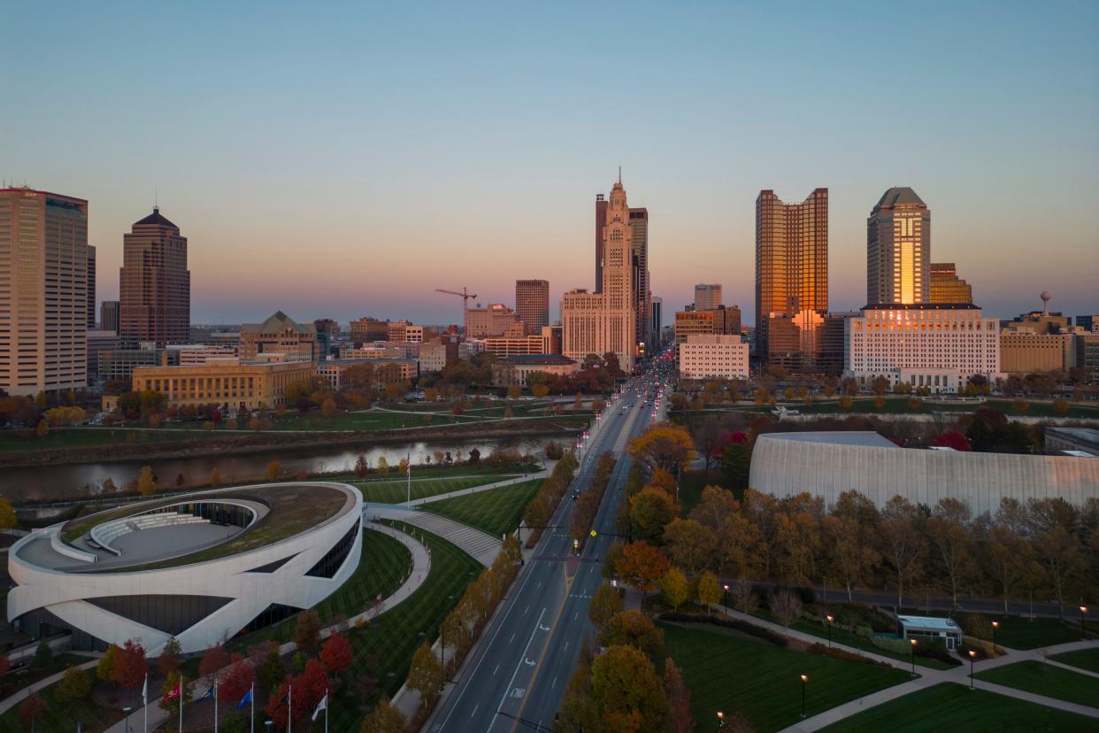 The setting sun illuminates the downtown Columbus skyline on a November 2023 evening.