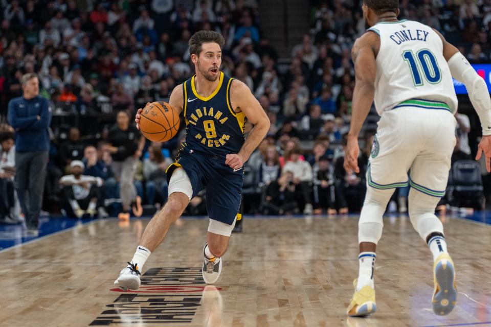 Dec 16, 2023; Minneapolis, Minnesota, USA; Indiana Pacers guard T.J. McConnell (9) is guarded by Minnesota Timberwolves guard Mike Conley (10) in the third quarter at Target Center. Mandatory Credit: Matt Blewett-USA TODAY Sports