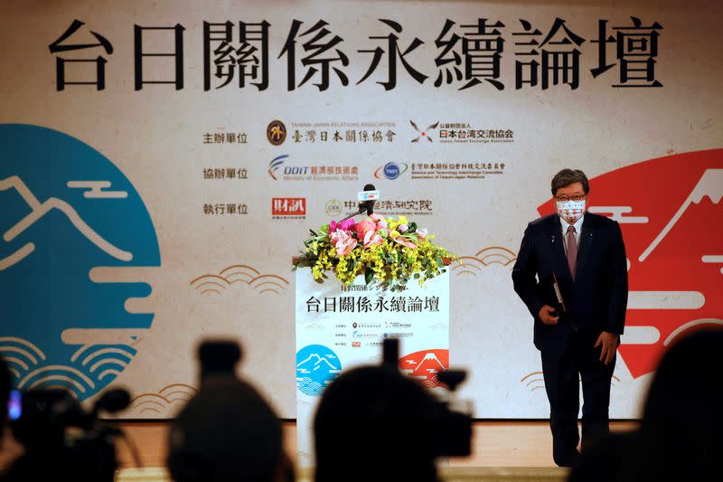 Koichi Hagiuda, policy chief for Japan's ruling Liberal Democratic Party arrives on stage to speak at a forum in Taipei
