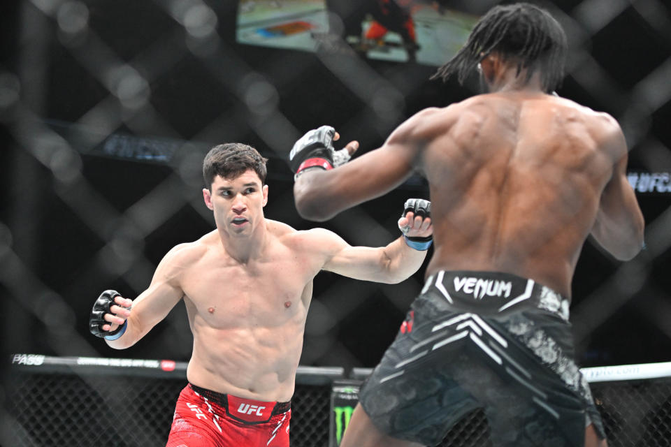 Jan 20, 2024; Toronto, Canada, USA; Neil Magny (red glove) fights Mike Malott (blue gloves) during UFC 297 at ScotiaBank Arena. Mandatory Credit: Dan Hamilton-USA TODAY Sports