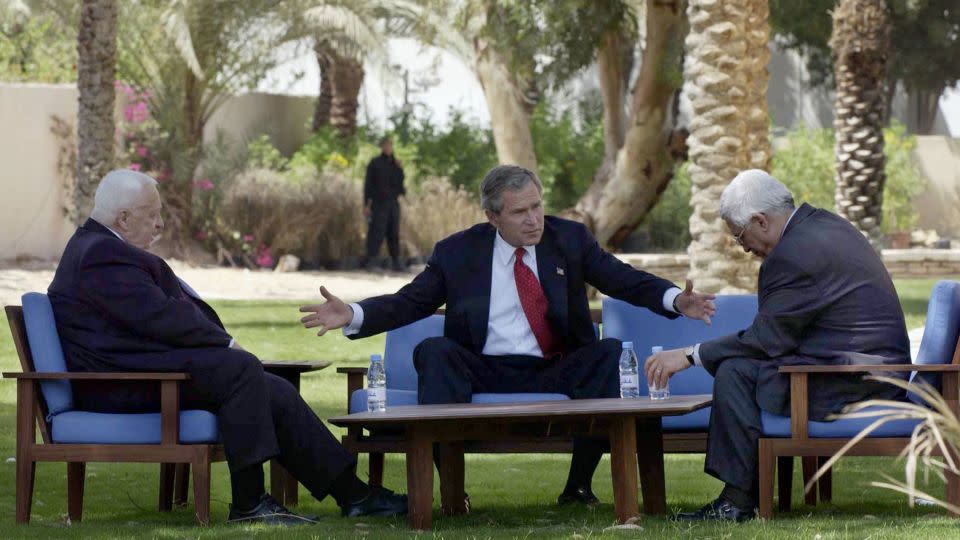 W. Bush, Israeli Prime Minister Ariel Sharon, and Palestinian leader Mahmoud Abbas met in 2003, in the Jordanian Red Sea resort of Aqaba.  - Avi Ohayon/Pool/AFP/Getty Images