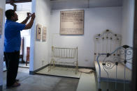 A visitor takes a photo of the replica of the room of Nobel laureate Gabriel Garcia Marquez at the museum set at the house were he was born in Aracataca, Colombia, Friday, April 18, 2014. Garcia Marquez died at the age of 87 in Mexico City on April 17, 2014. (AP Photo/Ricardo Mazalan)