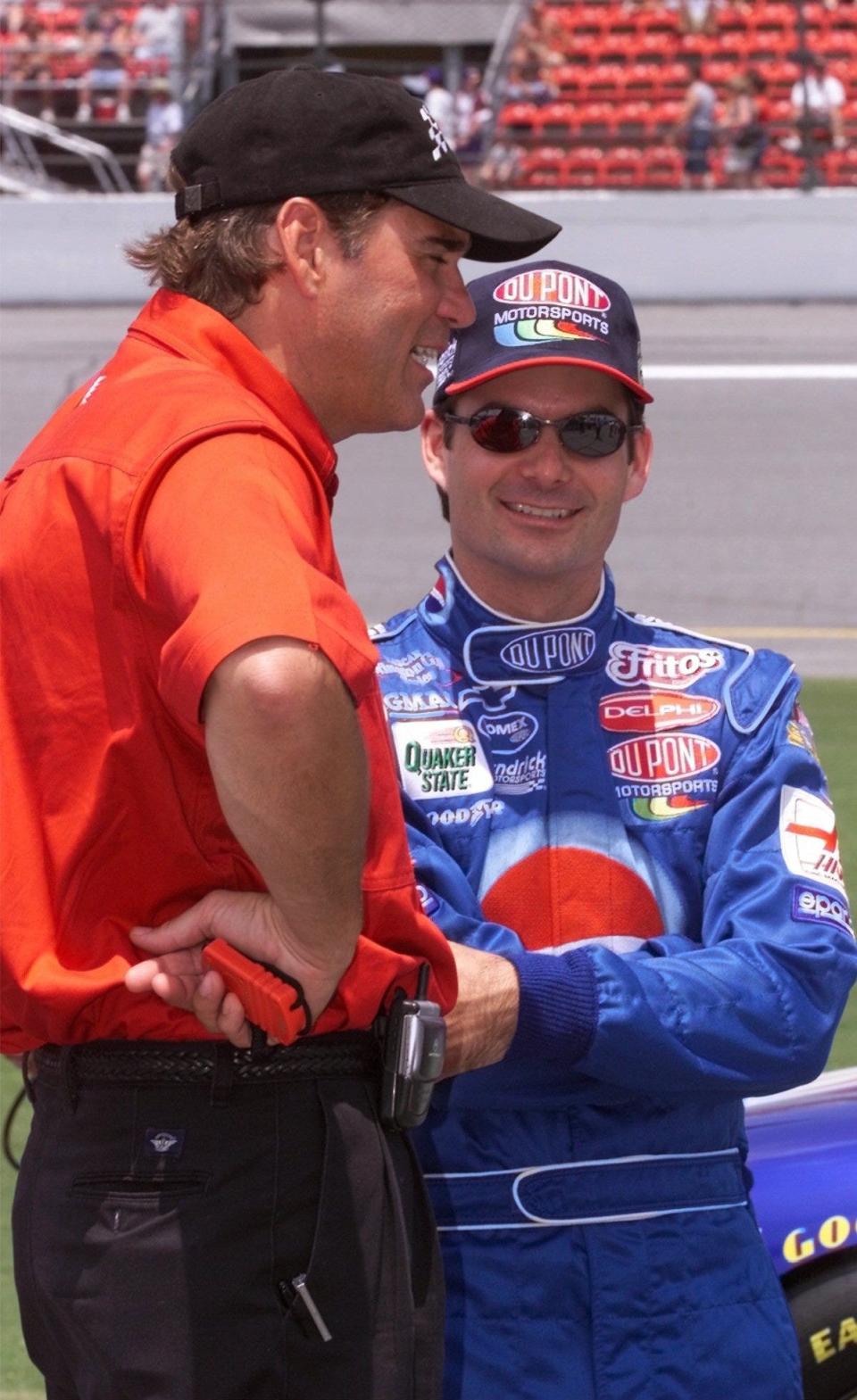 Jeff Gordon talks with former crew chief Ray Evernham just before the start of Pepsi 400 qualifying Friday morning, July 6, 2001.