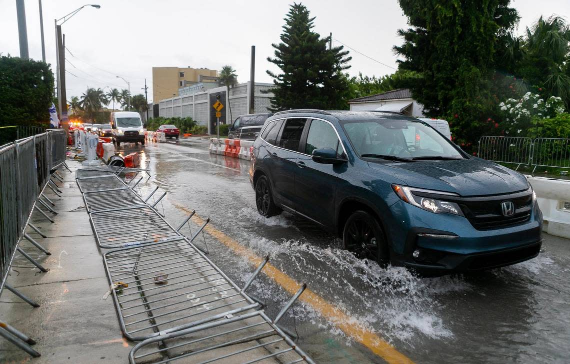 Cars drive down Harding Avenue near 88th Street in Surfside as heavy rain and thunderstorms made their way across South Florida on Monday, July 12, 2021. Could this be the scene again on the week of Aug. 26, 2022, and the weekend? Forecasters are calling for storm chances at 80% on Sunday and Monday, Aug. 28-29, 2022.