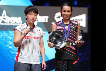 Badminton - Yonex All England Open Badminton Championships - Arena Birmingham, Birmingham, Britain - March 18, 2018 Taiwan's Tai Tzu Ying celebrates with the trophy after victory in the women's singles final alongside second placed Akane Yamaguchi of Japan Action Images via Reuters/Peter Cziborra