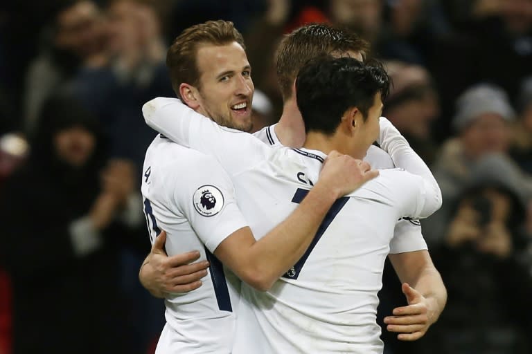 Tottenham Hotspur's striker Harry Kane (L) celebrates scoring the team's third goal with Son Heung-Min (R) on January 13, 2018