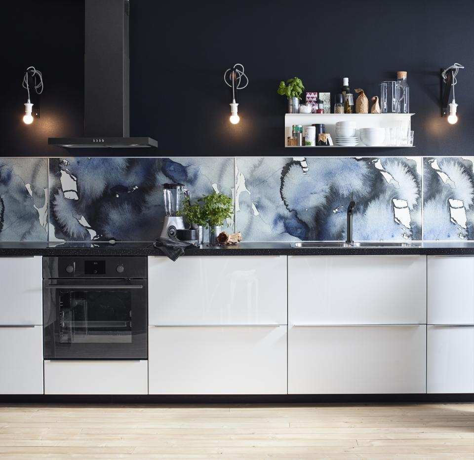 <p> Kitchen task lighting needn&#x2019;t be dull just because it&#x2019;s functional. In this room, white SEKOND cord sets and RYET lightbulbs all Ikea, stand out against the dark tones of the wall to illuminate the worktops and kitchen backsplash, creating a moody aesthetic. </p>