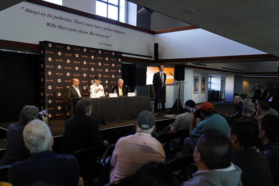 San Francisco Giants manager Bob Melvin answers questions as President of Baseball Operations Farhan Zaidi, left, and Chairman Greg Johnson, right, listen during an introductory baseball news conference at Oracle Park in San Francisco, Wednesday, Oct. 25, 2023. (AP Photo/Eric Risberg)