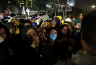 Relatives protest in front of a collapsed building after the earthquake in Mexico City, Mexico, September 25, 2017. REUTERS/Nacho Doce