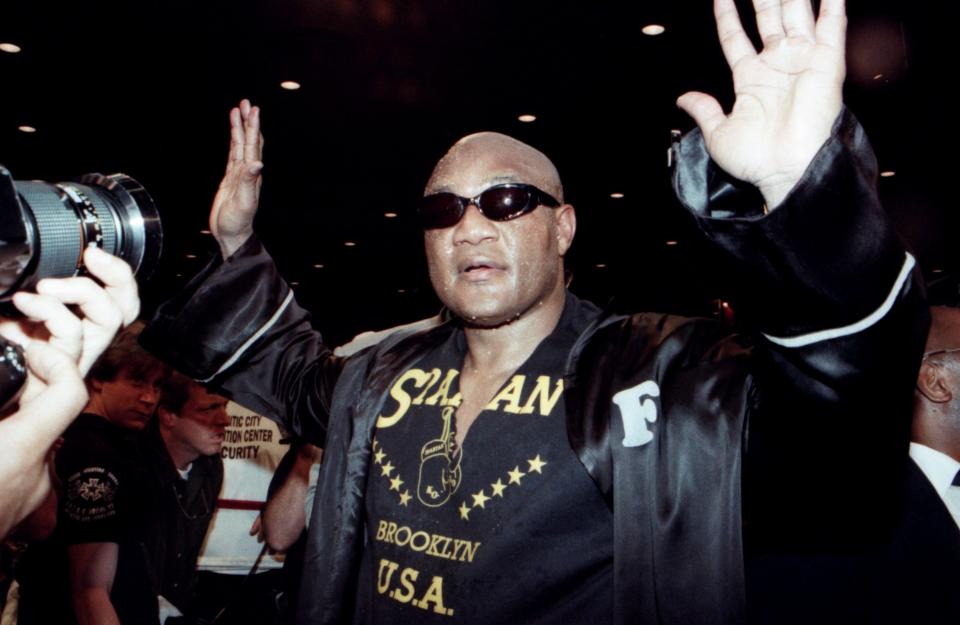 ATLANTIC CITY - APRIL 26,1997: George Foreman celebrates after winning the fight against Lou Savarese during the fight at Convention Center, Atlantic City, New Jersey. George Foreman won the World Boxing Union heavyweight title. (Photo by: The Ring Magazine/Getty Images)