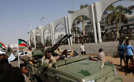 Sudanese soldiers are seen on their vehicles as they move with a military convoy outside the defense ministry compound in Khartoum, Sudan, April 25, 2019. REUTERS/Umit Bektas