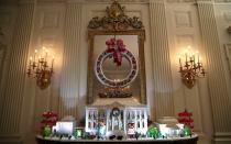 The White House Gingerbread House is seen in the State Dining Room.