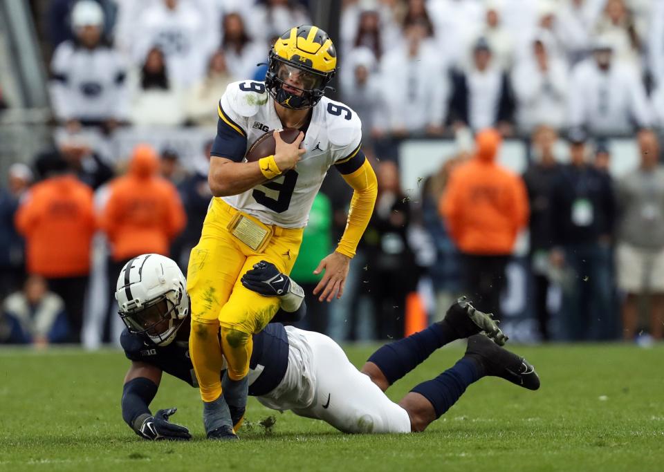 Nov 11, 2023; University Park, Pennsylvania, USA; Michigan Wolverines quarterback J.J. McCarthy (9) runs the ball against the Penn State Nittany Lions during the fourth quarter at Beaver Stadium. Michigan won 24-15. Mandatory Credit: Matthew O'Haren-USA TODAY Sports