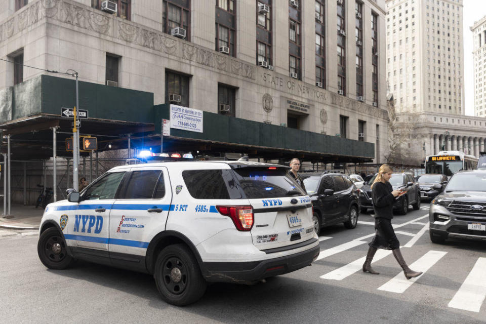 An NYPD vehicle outside the Manhattan district attorney's offices in New York on Wednesday, March 22, 2023. / Credit: Angus Mordant/Bloomberg via Getty Images