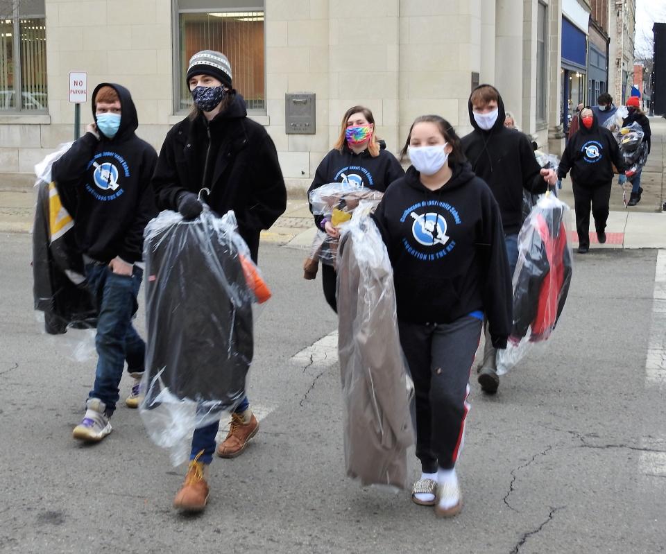 Students from the Coshocton Opportunity School on Dec. 13 will hang coats and winter wear from trees along Main Street for the homeless and needy.