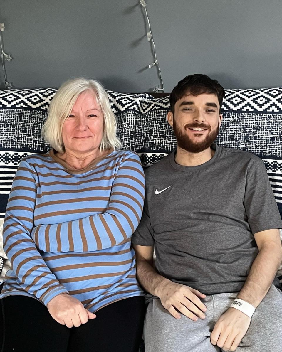 Mother and son sitting next to each other 