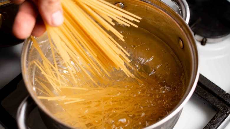 pasta going into boiling water