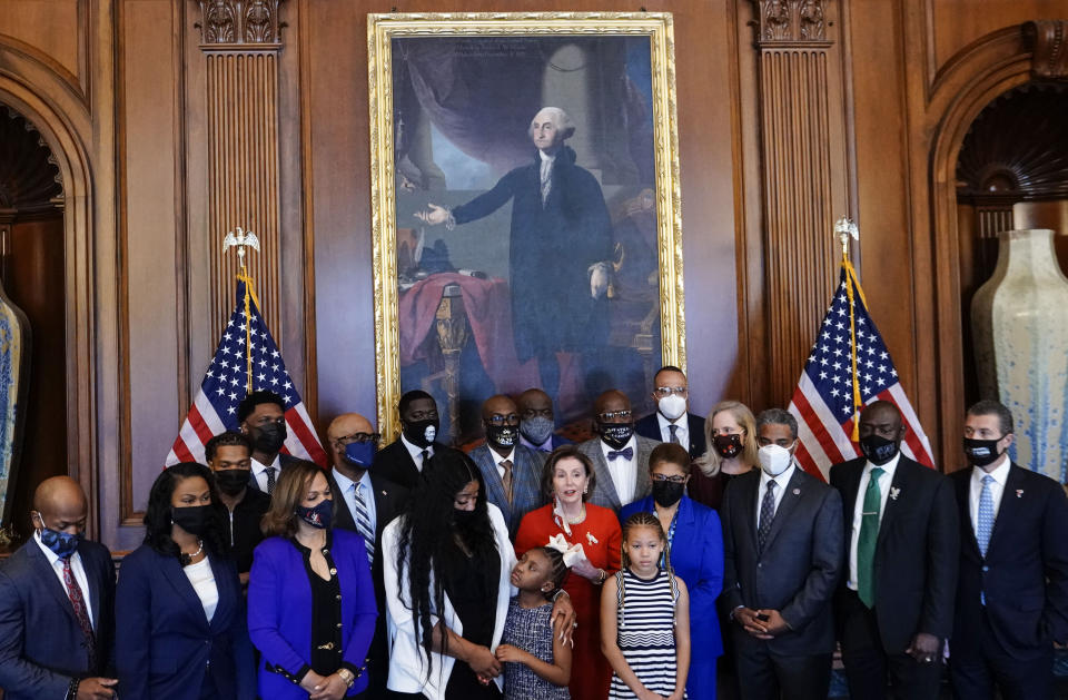 House Speaker Nancy Pelosi, D- Calif., speaks to reporters while standing with members of the Floyd family prior to a meeting to mark the anniversary of the death of George Floyd, Tuesday, May 25, 2021 at the Capitol in Washington. (Erin Scott/Pool via AP)
