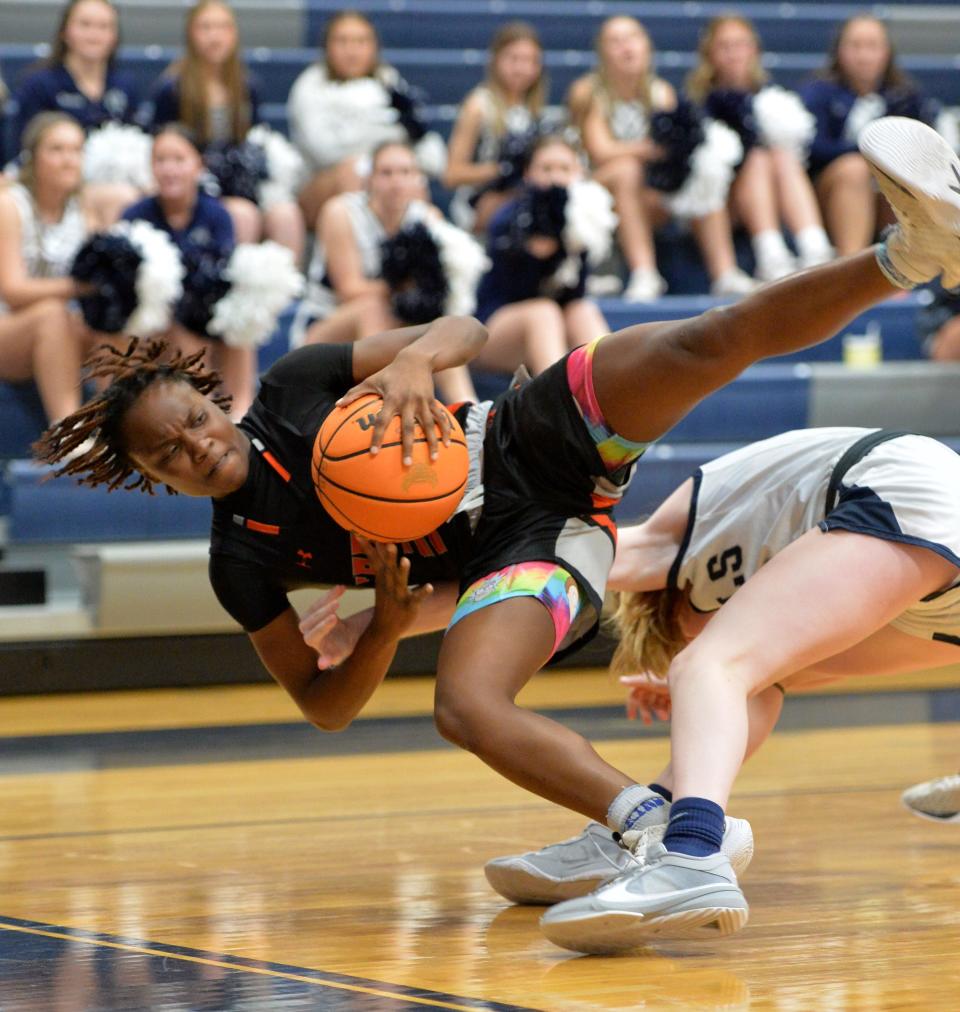 Lely's Jeade Leo (#3) collides with Parrish's Jayna Bowen (#13) as they both go after a loose ball. Parrish Community High School hosted Lely High School in the Class 5A Region 3 girls basketball playoff Monday night, Feb. 19, 2024