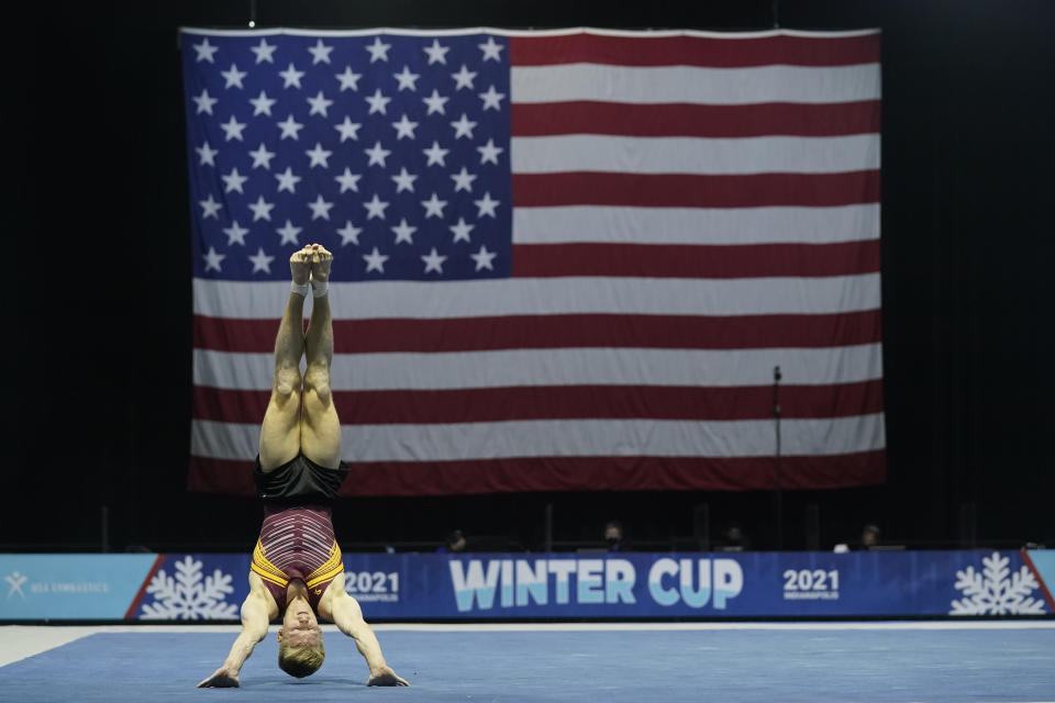 Shane Wiskus, representing the University of Minnesota, competes during the Winter Cup gymnastics event Sunday, Feb. 28, 2021, in Indianapolis. The University of Minnesota and the University of Iowa will stop offering men's gymnastics as a scholarship sport at the end of the month. Wiskus wants to be part of the U.S. Olympic gymnastics team. It's one of the reasons he left Minnesota last fall for the U.S. Olympic and Paralympic Training Center in Colorado Springs, Colorado. (AP Photo/Darron Cummings)