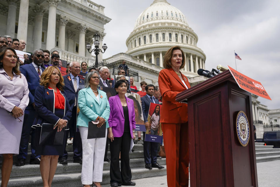 FILE - House Speaker Nancy Pelosi of Calif., stands with other lawmakers as she speaks about the gun violence bill at the Capitol in Washington, Friday, June 24, 2022. (AP Photo/J. Scott Applewhite, File)