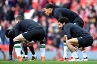 <p>Liverpool players warm up </p>