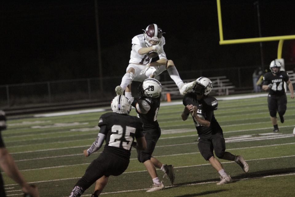 Hawley wide receiver Kason O'Shields leaps over a couple Forsan defenders on a kick return on Friday, Nov. 5. The Bearcats advanced to the regional final game against Cisco, beating Coleman 21-7.