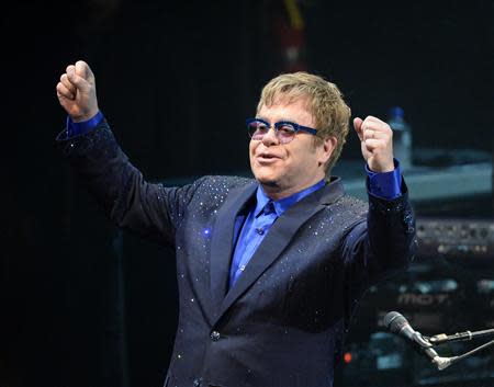 Musician Elton John performs songs off his new album "The Diving Board" with USC Thornton School of Music students in Los Angeles, California on September 16, 2013. REUTERS/Kevork Djansezian/Files