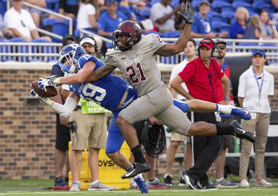 Duke's Jake Bobo makes a diving catch ahead of North Carolina Central's Daryl Smith.