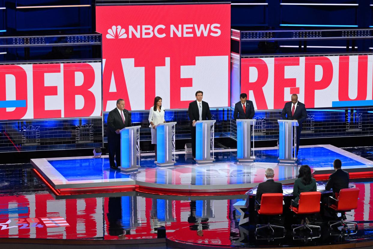 From left: former New Jersey Gov. Chris Christie, former South Carolina Gov. Nikki Haley, Florida Gov. Ron DeSantis, entrepreneur Vivek Ramaswamy and South Carolina Sen. Tim Scott onstage at the third Republican presidential primary debate in Miami on Wednesday. 