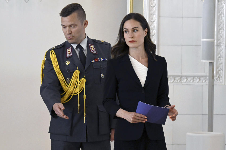 Former Prime Minister and leader of the outgoing government Sanna Marin, right, pays a farewell visit to President of Finland Sauli Niinisto at the Presidential Palace in Helsinki, Finland, Tuesday June 20, 2023. (Jussi Nukari/Lehtikuva via AP)