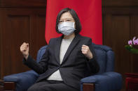 In this photo released by the Taiwan Presidential Office, Taiwanese President Tsai Ing-wen gestures during a meeting with lawmakers from Baltic states at the Presidential Office in Taipei, Taiwan on Monday, Nov. 29, 2021. Lawmakers from all three Baltic states met with Tsai on Monday in a sign of further cooperation between European Union nations and Taiwan. (Taiwan Presidential Office via AP)